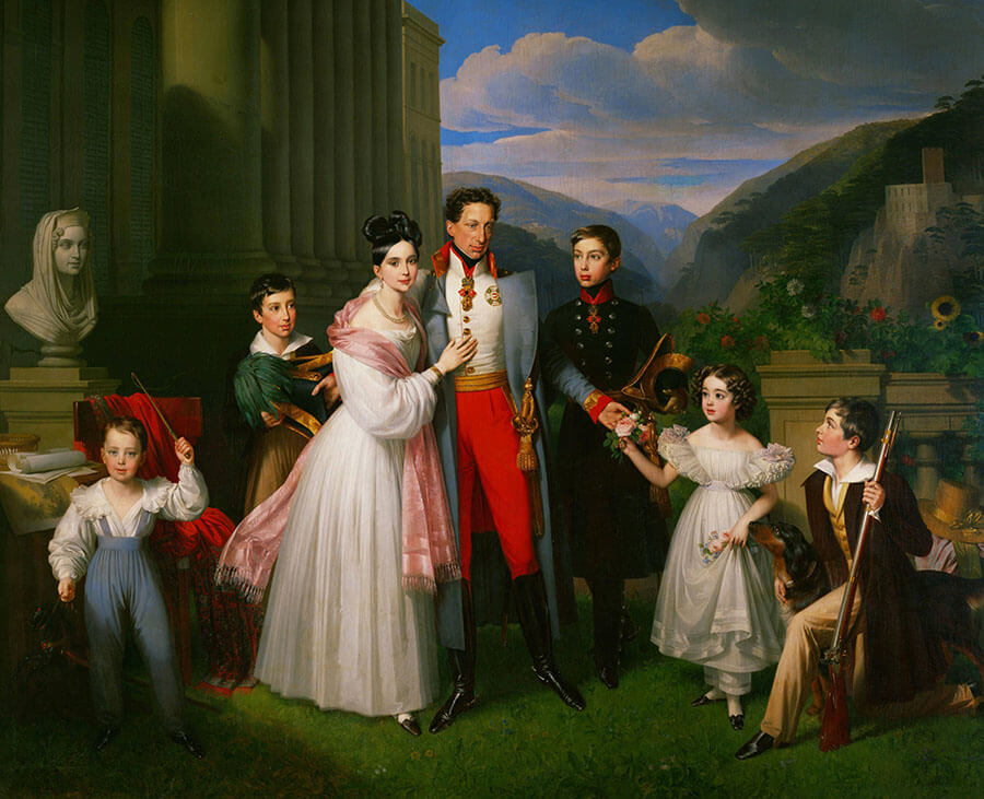 Erzherzog Karl mit seiner Frau und fünf Kindern im Garten. Links im Hintergrund der Eingang zum Schloss, rechts eine Ruine.